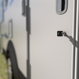 Close up of motor home with key in the lock on the door
